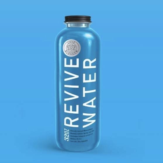 A bottle of water with the words revive water on it.